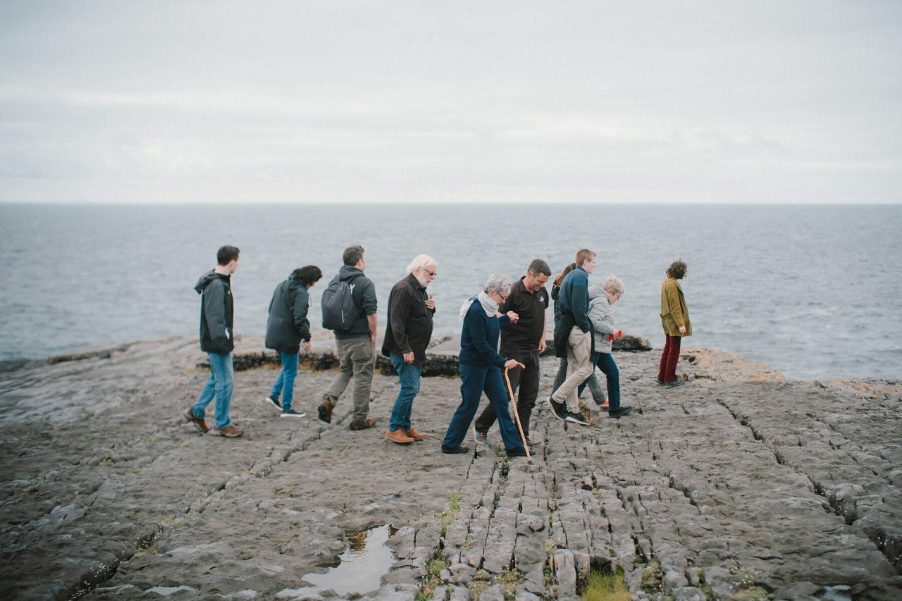 Group of Tourist on a Cliff by the Atlantic Coast 